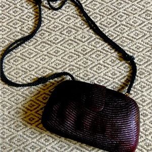 women’s woven straw purse w/ braid black silky shoulder strap.  Dark burgundy